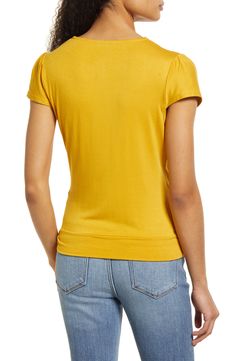 A faux-wrap front flatters on this soft and versatile jersey top cinched with a saucy tie at the hip. 23 1/2" length Surplice V-neck Short sleeves 95% rayon, 5% spandex Machine wash, dry flat Imported Women's Clothing Stretch Rayon V-neck Top, Fitted V-neck Rayon Top, Chic Modal V-neck Tops, Chic V-neck Modal Tops, Spring Ruched Viscose Tops, Fitted Tops With Surplice Neckline For Spring, Fall Surplice Neckline Tops, Soft Stretch Tops For Workwear, Versatile V-neck Ruched Tops