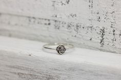 Someone once said that flowers are God's sweetest creations without a soul, and we couldn't agree more and the rose is the most beloved flower of all time. Roses symbolize love and happiness. This dainty rose ring is the perfect way to express your love, friendship or admiration for your beloved! Crafted from sold sterling silver. This ring is beautiful on its own or looks lovely stacked with my sterling silver vine ring linked below. ✥ Sterling Silver ✥ Available in sizes 3-10 ✥ Beautifully box Dainty Rose Design Flower Ring For Anniversary, Adjustable Rose Design Flower Ring As Gift, Dainty Rose Design Flower Ring For Gift, Dainty Rose Colored Rings As Gift, Dainty Rose Design Flower Ring Gift, Delicate Rose Design Flower Ring As Gift, Elegant Flower Ring With Roses For Gift, Delicate Rose Design Flower Ring Gift, Adjustable Roses Flower Ring Gift