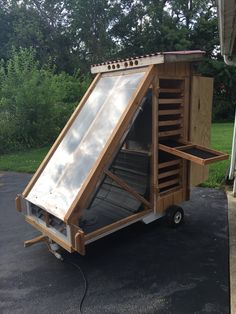 a small wooden structure sitting on top of a parking lot