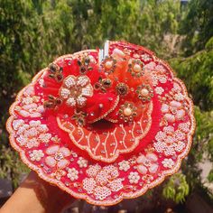 Handwork poshak for laddu gopal. It includes one poshak, one patka and mukut. Traditional Red Tikka As Gift, Red Tikka With Tilla As Gift, Red Tikka For Puja And Festivals, Red Tikka For Navratri, Multicolor Tikka For Puja And Diwali, Traditional Handmade Tikka For Festivals, Handmade Traditional Tikka For Festivals, Gota Work Tikka For Festivals And Gifts, Multicolor Tikka For Diwali Puja