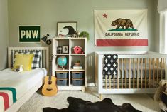 a baby's room with a bed, crib and other items in it