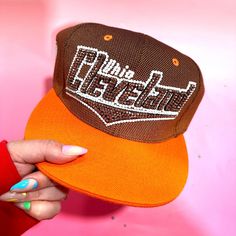 This is a Cleveland Browns SnapBack hat. It was hand rhinestoned with brown, black and white gems and is a show stopper! Go Browns Brown Rhinestone Hat, Go Browns, Brown Hats, Hats Snapback, Cleveland Browns, Snapback Hat, Trucker Cap, Snapback Hats, Crystal Rhinestone