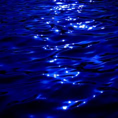 the blue water is reflecting light on it's surface