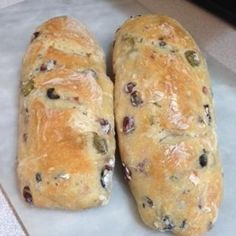 two loaves of bread sitting on top of a counter