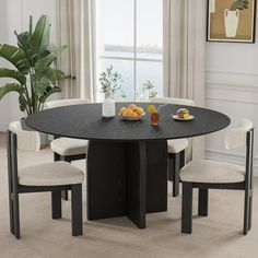 a dining table with four chairs around it