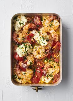 a casserole dish with shrimp and tomatoes