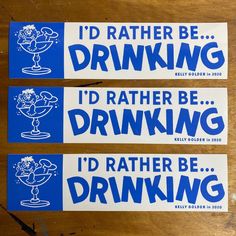 two blue and white stickers that say i'd rather be drinking