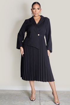 Elevate your style with our Chic Elegant Blazer Top Dress. This chic black dress features a tailored blazer top with long sleeves and a sophisticated front gold button detail. The pleated skirt adds a touch of graceful movement, making it perfect for both formal occasions and upscale events. A blend of classic elegance and modern flair, this dress ensures you stand out with effortless sophistication. 100% Polyester Dressy Long Sleeve Blazer For Work, Tailored Long Sleeve Jacket Dress For Office, Formal Long Sleeve Jacket Dress For Office, Formal Long Sleeve Single-breasted Jacket Dress, Elegant Formal Pleated Dress For Fall, Elegant Black Long Sleeve Skirt Suit, Elegant Tailored Pleated Blazer, Black Long Sleeve Skirt Suit For Evening, Elegant Fall Pleated Dress