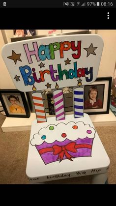 a birthday chair made to look like it has a cake on it and the words happy birthday