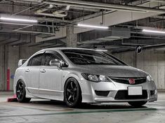 a silver car parked in a parking garage