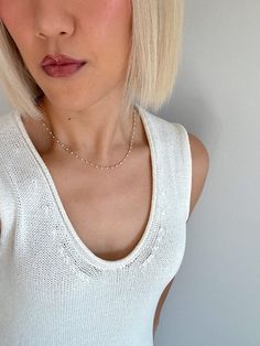 Embrace timeless elegance with our White Mini Pearl Necklace, designed for the modern woman who adores dainty, feminine jewelry. This necklace features an Italian wire-wrapped chain, adjustable from 16 to 18 inches, adorned with delicate 2mm pearl accents throughout. Perfect for layering or wearing alone, this necklace adds a touch of sophistication to any outfit. Whether you're heading to a brunch date or a night out, the White Mini Pearl Necklace is your go-to for effortless, everyday elegance Minimalist Pearl Chain Necklace For Layering, Minimalist Everyday Pearl Necklace With Beaded Chain, White Dainty Chain Necklace For Everyday, White Pearl Choker With Delicate Chain, Everyday Minimalist Pearl Necklace With Beaded Chain, Minimalist Layering Pearl Chain Necklace, Dainty White Chain Necklace For Everyday, Delicate Pearl Chain Necklace For Layering, Chic Pearl Chain Necklace With Delicate Design