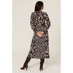 Blue floral crepe (100% Polyester). Hourglass. V-neck. Long sleeves. Back zipper closure. 50" from shoulder to hemline. Imported. Chic V-neck Floral Dress For Fall, Elegant V-neck Midi Dress With Ditsy Floral Print, Blue Floral Print Midi-length V-neck Dress, Blue Floral Print V-neck Midi Dress, Floral Print V-neck Dress For Fall, Blue V-neck Midi Dress With Ditsy Floral Print, Fall Ditsy Floral Print V-neck Floral Dress, Chic Blue V-neck Dress For Fall, Floral Print Long Sleeve V-neck Dress