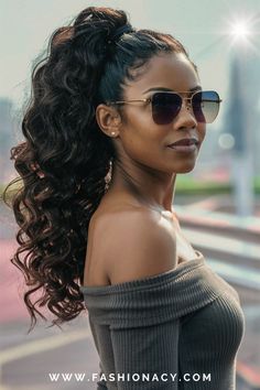 Explore the versatility of curly ponytails for black women, showcasing the richness and diversity of hairstyles tailored to complement various tastes and preferences. Curly Ponytails For Black Women, Black Curly Ponytail, High Ponytail Hairstyles For Black Women, Curly Ponytail Black Women, Ponytails For Black Women