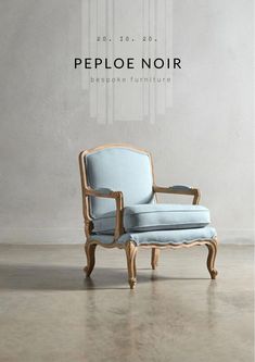 a blue chair sitting on top of a floor next to a wall with the words people noir