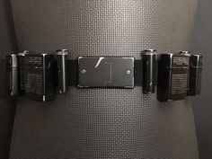 "Beautifully hand crafted adjustable utility belt with functional pouches. Pouches are approximately 3.75\"H x 2.5\"W x 1\"D. Belt is 2\" wide and made of nylon strapping with a buckle in the back and is adjustable from 29 to 43 inches. Decorative front buckle is metal which has been painted and clear coated. PLEASE READ: When placing an order for your belt please include the LENGTH ( in inches) you would like your belt. Please note that your pants size isn't necessarily your waist size, measure Batman Redesign, Tactical Armor, Batman Inspired, Batman Armor, Tactical Clothing, West Chester, Utility Belt, Belt Pouch, Mini Bottles