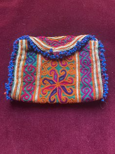 Embroidered afghan wallet - I added a big snap so it closes nicely . Made for the tourist market in 1970s  By 1980 the Russians were there and this business was over I think these are hand made work but maybe hand work with a machine that isn't an automatic computer one Vintage Multicolor Bags For Festivals, Traditional Handmade Brown Pouch, Bohemian Rectangular Pouch For Daily Use, Traditional Handmade Pouch With Multicolor Embroidery, Embroidered Multicolor Pouch For Festival, Bohemian Multicolor Clutch Pouch, Multicolor Vintage Shoulder Bag For Festivals, Vintage Multicolor Embroidered Shoulder Bag, Vintage Embroidered Shoulder Bag For Festivals