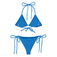 Stay comfortable and beach ready all summer in this FYC String Bikini set. It’s made from soft recycled polyester with double-layering and UPF 50+. Style the straps how you like, and get ready to swim! • Soft and stretchy material with UPF 50+ • Sizes up to 4XL • Bikini top comes with removable padding for comfort • Multiple ways to tie and style the bikini set Disclaimer: To make your All-Over Print Recycled String Bikini last longer, thoroughly rinse it off after each use and get rid of any ch Adjustable Straps Beachwear Swimwear, 4-way Stretch Swimwear For Water Sports In Summer, Adjustable Nylon Swimwear For Poolside, Adjustable Nylon Swimwear For Sunbathing, Adjustable Blue Nylon Swimwear, Adjustable Nylon Swimwear For Beach Season, Sporty Swimwear With Adjustable Straps For Beach Season, Adjustable Swimwear With Upf 50+ For Beach, Adjustable Upf 50+ Swimwear For Beach