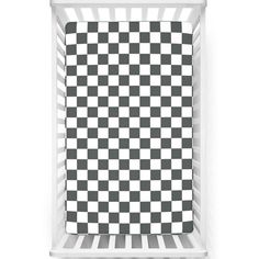 a black and white checkered blanket in a crib