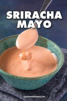 a spoon is pouring sauce into a bowl with the words sriracha mayo on it