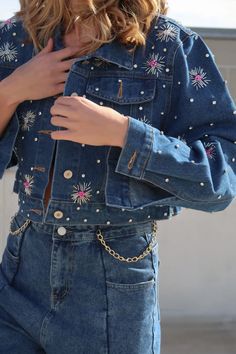 Embellished cropped denim jacket perfect for spring! Color: medium wash One size fit runs long in sleeves Cotton/Polyester Hand Wash or Dry clean Button front closure length 17” Embellished Denim Jacket, Denim Flowers, Embellished Denim, Spring Color, Custom Jacket, Cropped Denim Jacket, Denim Material, Material Handling, Design Silver