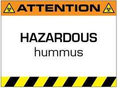 a hazard sign with the words hazardous hummus written below it in black and yellow