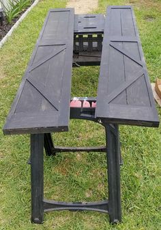 an outdoor table with two benches on it