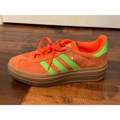 Women's Orange Sneakers By Adidas Originals The Gazelle H06126 Us Size: 6 Eu Size: 37.5 * Collegiate Orange Suede Body; Neon Green Leather Panels * Layered Tan Rubber Soles * Lace Up Condition: In Great Condition. Minimal Wear At Body And Soles. See Photos For Additional Details. Please Let Me Know If You Have Any Additional Questions And Feel Free To Check Out My Other Listings. Thanks! 43803 Adidas Lace-up Platform Sports Sneakers, Adidas Casual Platform Sneakers With Laces, Adidas Platform Sneakers With Boost Midsole, Adidas Sneakers With Gum Sole, Adidas Low-top Platform Sneakers With Laces, Low-top Adidas Platform Sneakers, Adidas Lace-up Platform Sneakers, Adidas Platform Sneakers With Gum Sole, Adidas Platform Sneakers With Round Toe