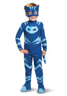 a young boy in a blue cat costume standing on one leg and wearing a mask