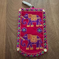 an elephant is on the table with a pair of scissors in it's pouch