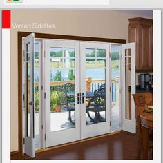 an open patio door in a kitchen with wooden cabinets and wood flooring on the side