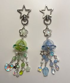 pair of dangling earrings with stars and beads