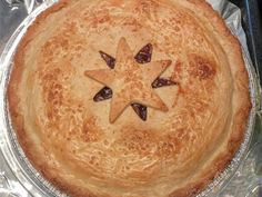 a baked pie with star decoration on top