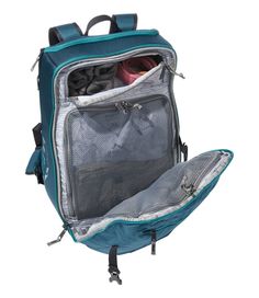 an open backpack with clothes in it