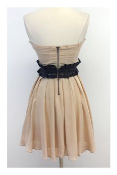 Size 2 Nude Strapless Dress Body 100% Silk Combo 100% Genuine Lamb Leather Lining 93% Silk 7% Spandex Exposed back zip Boned bodice Pleated bust Laser cut leather waist band Hip pockets Across top of bust 14.75" Under bust 13.75" Waist 26" Roomy hip area Total length 28" Chic Backless Corset Dress With Boned Bodice, Fitted Dress With Cut-out Waist For Date Night, Chic Underbust Dresses For Party, Chic Underbust Party Dresses, Chic Summer Corset Dress With Back Zipper, Fitted Bodice Underbust Dress For Date Night, Chic Strapless Dress With Fitted Waist, Date Night Dresses With Fitted Bodice And Underbust, Chic Strapless Evening Corset Belt