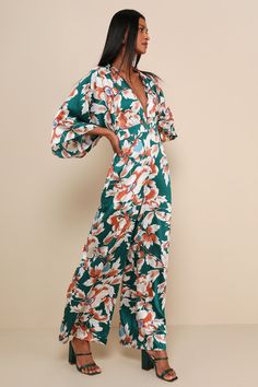 The Lulus From Sunrise Teal Floral Print Wide-Leg Jumpsuit will have you lounging by the pool by day and sipping margaritas by night! Lightweight woven satin (in a cream, rust, blue, and teal floral print) shapes this vacay-ready jumpsuit with a plunging V-neckline, gathered bodice, and flowy sleeves. An elasticized, banded waist, with two long sash ties, falls to tailored wide-leg pants. Keyhole opening and button closure at back. Fit: This garment fits true to size. Length: Floor length. Size Spring Brunch Green Jumpsuits And Rompers, Green Jumpsuits And Rompers For Spring Brunch, Chic Printed Jumpsuits And Rompers For Brunch, Green Floral Print Jumpsuits And Rompers For Brunch, Green Floral Print Jumpsuit For Brunch, Spring V-neck Jumpsuits And Rompers For Poolside, Cute Jumpsuit, Gathered Bodice, Floral Print Jumpsuit