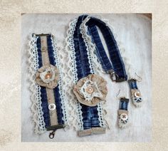 an old pair of blue and white lace garters with flower brooches