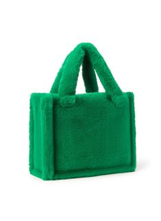 Crafted from panels of plush faux fur, the JADE Tote Bag features a structured silhouette and delightfully soft handles. Its spacious size is designed to hold everyday essentials. Green Rectangular Shoulder Bag For Winter, Green Winter Shopping Bags, Rectangular Faux Fur Shoulder Bag, Faux Fur Tote Shoulder Bag, Rectangular Faux Fur Bag With Fur Lining, Rectangular Faux Fur Bag For Daily Use, Rectangular Faux Fur Shoulder Bag For Everyday Use, Fluffy Faux Fur Tote Bag, Everyday Rectangular Faux Fur Shoulder Bag