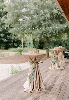 the tables are set up on the deck for an outdoor wedding reception at this venue