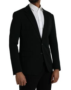 This single breasted blazer from Dolce & Gabbana features a two button closure, notched lapels, and a slim fit. Crafted from a luxurious black wool-silk blend, the blazer is detailed with an embroidered logo on the front chest patch pocket and two side flap pockets. The long sleeves, curved hem, and one open vent in the back add a sleek touch to the blazer's design. Made in Italy, the lining is made of 92% silk and 8% elastane, while the material is composed of 92% virgin wool and 8% nylon. Single Breasted Blazer, Single Breasted Coat, Style Noir, Boot Pumps, Breasted Blazer, Blazers For Men, Armani Exchange, Dolce & Gabbana, Blazer Coat