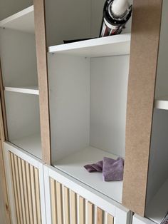 an open book shelf with some books on it