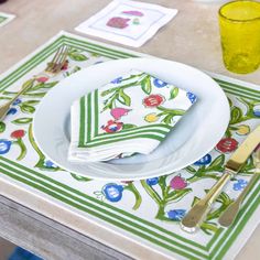 a place setting with napkins and utensils