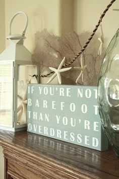 a wooden sign that says if you're not bare foot than you're overdressed