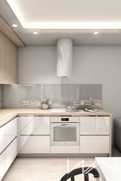 a modern kitchen with white cabinets and stainless steel appliances, along with a glass dining table