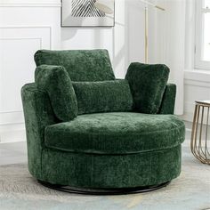 a green chair sitting on top of a rug