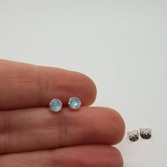 Tiny Aquamarine and Sterling Silver Stud Earrings - Minimalist jewelry these silver studs are versatile enough to look great with Jeans and your Lil Black Dress.  Aquamarine Cabochons are 4mm. These sterling silver studs are fastened with 925 sterling silver butterfly backs. To See Our Rings: https://etsy.me/2KTlJa8 And Necklaces: https://etsy.me/2CIBoG8 ♥ ♥ All pieces come packaged in a gift box ♥ ♥ Multiple items in one order will be combined into one gift box (let me know if you will need sep Silver Minimalist Birthstone Earrings, Tiny Blue Minimalist Earrings, Minimalist Birthstone Earrings, Minimalist Birthstone Earrings For Everyday, Minimalist Everyday Earrings With Birthstone, 2nd Piercing, Minimalist Stud Earrings, Aquamarine Studs, Stamped Earrings