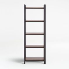 a tall wooden shelf sitting on top of a white floor