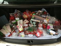 a car trunk filled with lots of presents