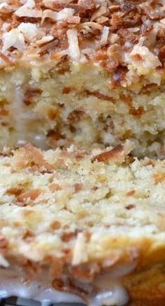 a close up of a cake with frosting and toppings on the top slice