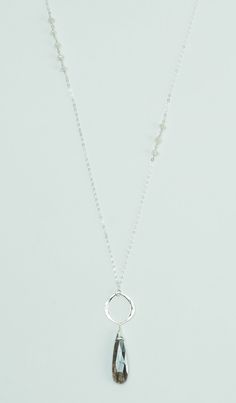 The Moonstone Silver Long Necklace is stunning in neutral pastels and purplish greys. Pair this beauty with jeans and a cream blouse for an elegant look perfect for casual Friday at the office or brunch with your friends. The moonstone pendant changes color when the light hits it making it for a unique statement piece. Size - 4 to 5mm rondelles, 2" pendant drop, 32" long chain Metals - sterling silver Materials - moonstone, pearl chalcedony Long Necklaces Silver, Everyday Moonstone Necklaces, Everyday Moonstone Necklace, Silver Long Necklace, 32 Necklace, Cream Blouse, Long Silver Necklace, Long Necklaces, Casual Friday