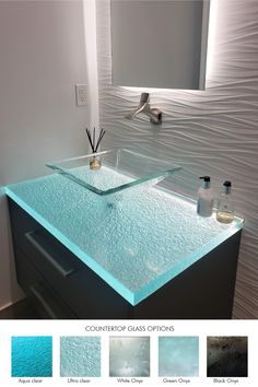 a bathroom vanity with blue glass counter top